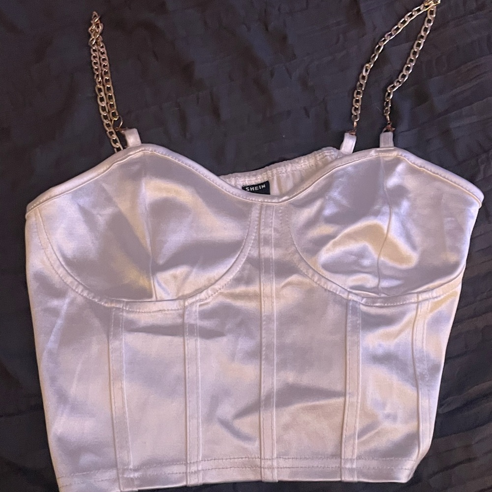 Silky tank top, not great padding but looks good with the right bra